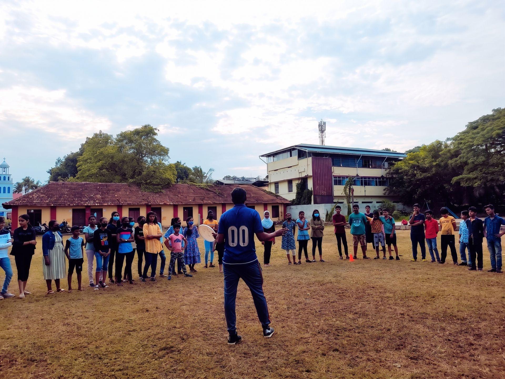 A coach leading a session with a group of children